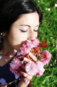 woman smelling flowers