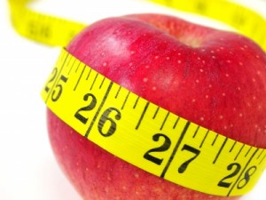 measuring tape around an apple