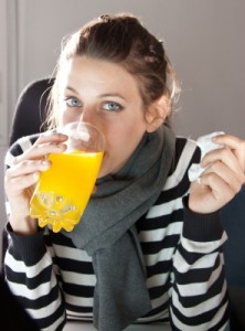 woman drinking orange juice