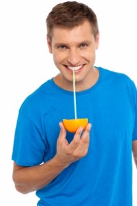 man-drinking-orange-juice